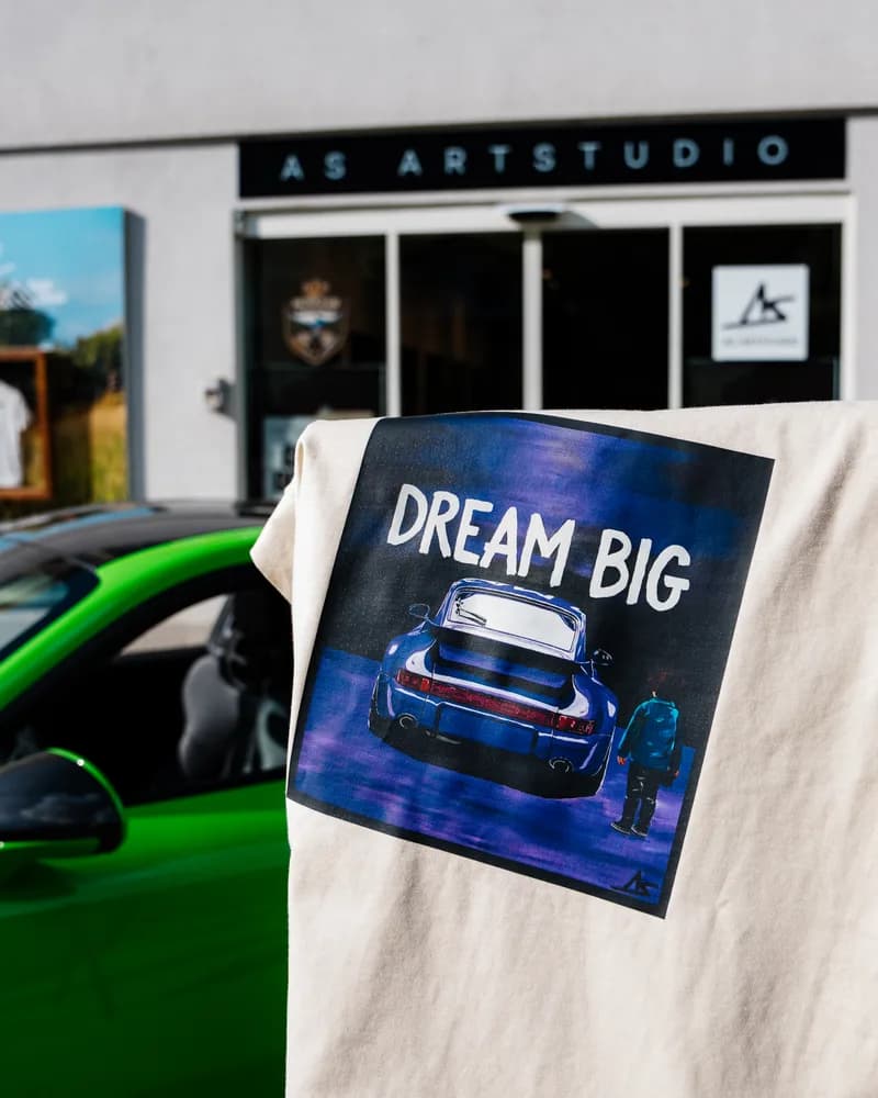 The Dream Big shirt beside the painting it was printed from