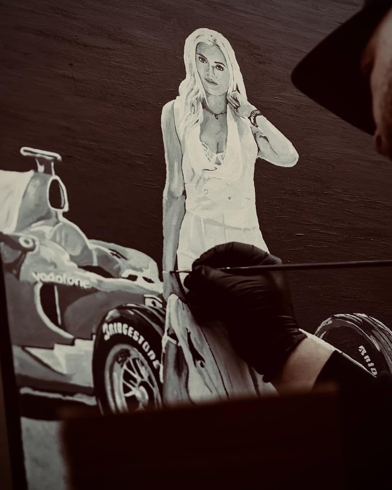 Black-and-white painting of Laura Sommer with a Formula 1 car, work in progress