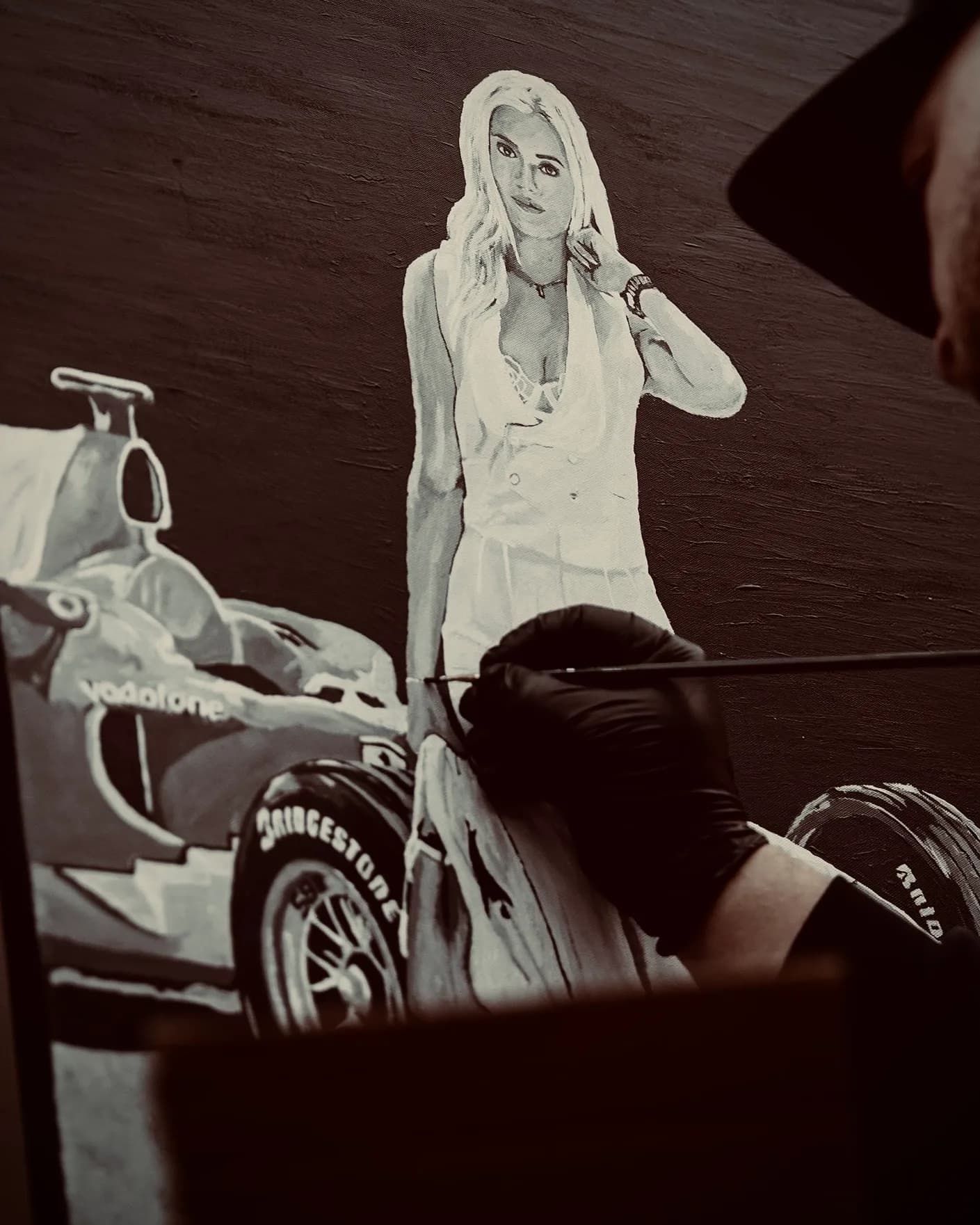 Black-and-white painting of Laura Sommer with a Formula 1 car, work in progress