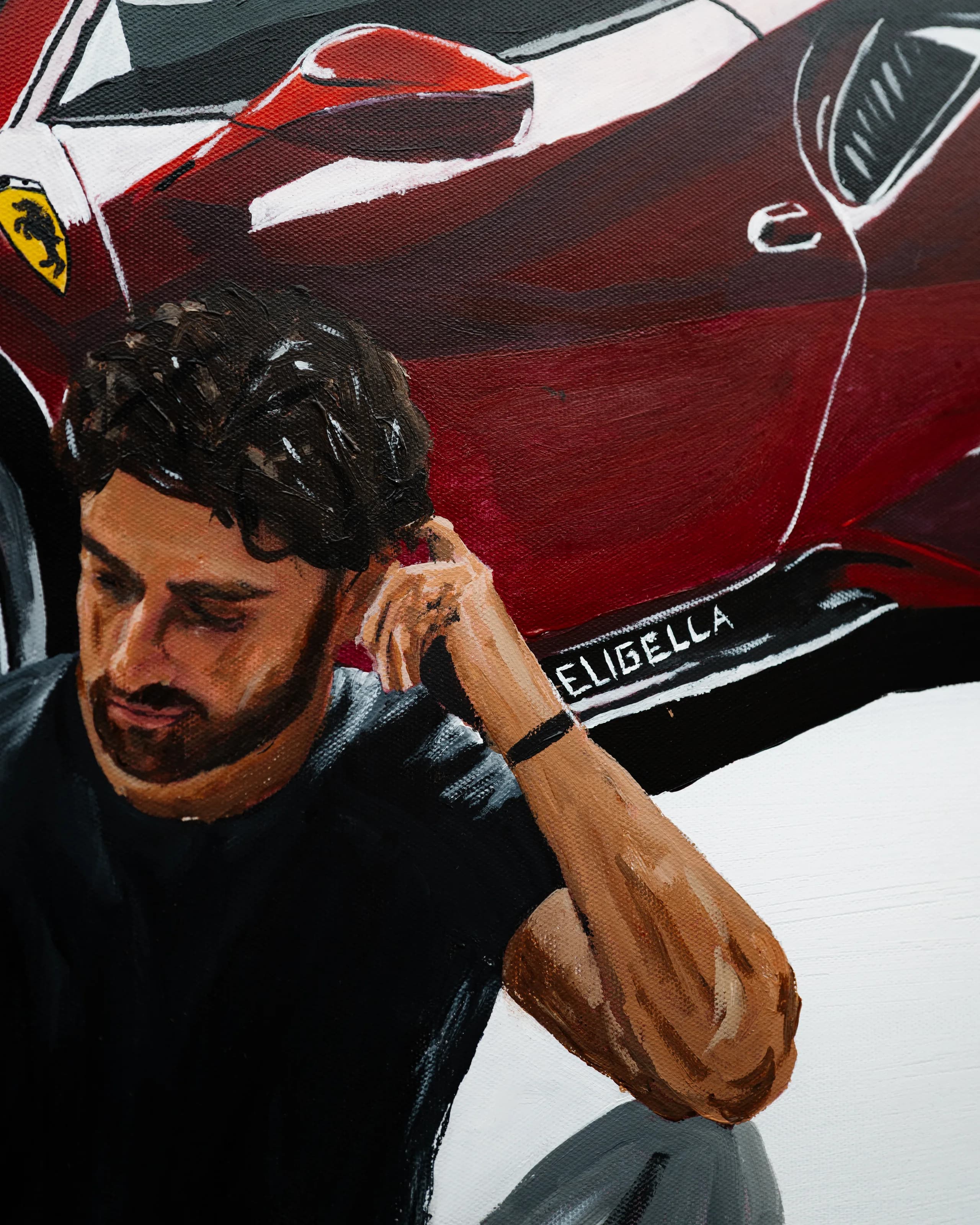Detail of the painted seated man against the car’s flank