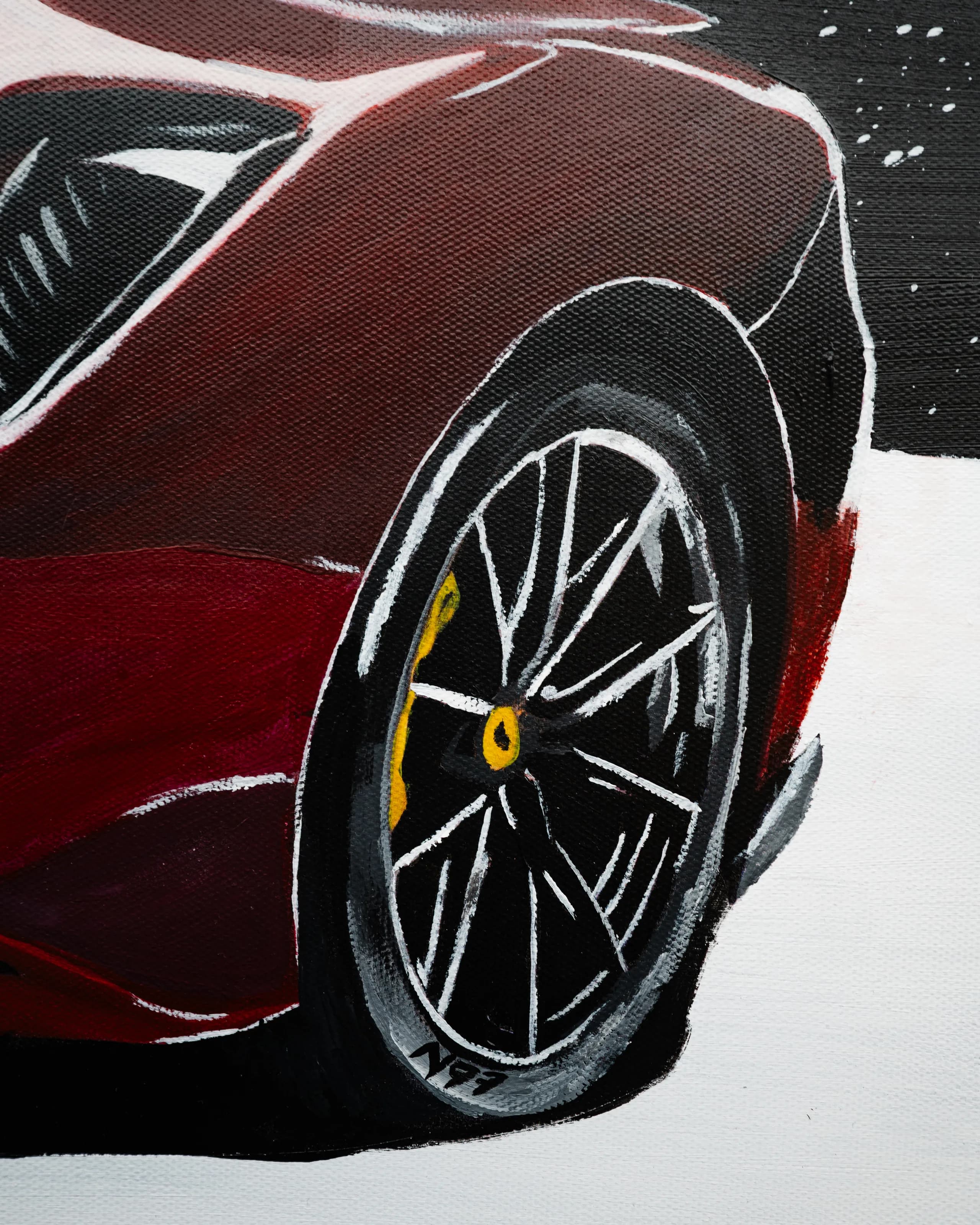 Detail of the painted rear wheel of the Ferrari
